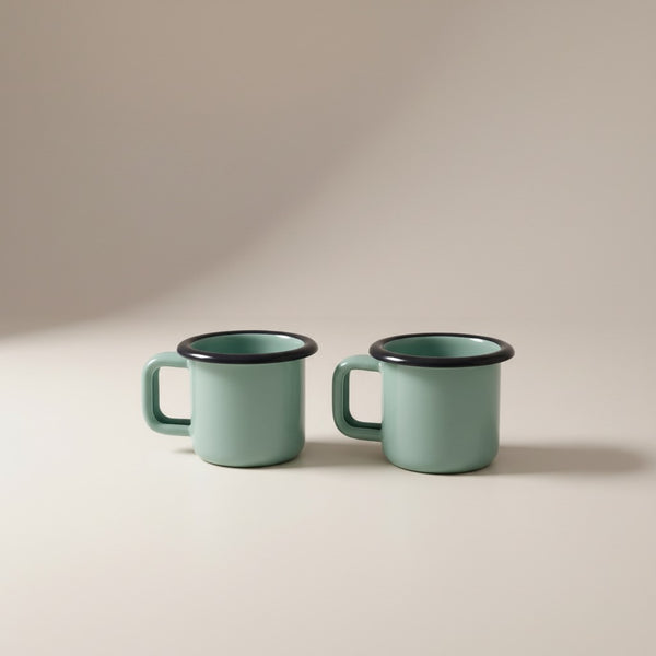 Vaisselle Emaillée set of 2 mint green enamel metal espresso cups, 100ml capacity, with black rim detail.