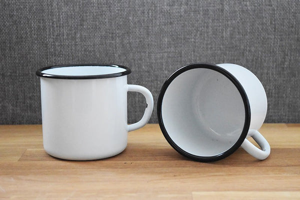 Vaisselle Emaillée white enamel mugs with black rim, 250ml capacity, sold as a set of 2.