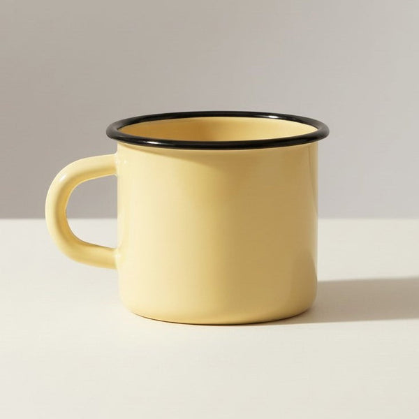 Vaisselle Emaillée yellow enamel metal mug with black rim, 400ml capacity. Ideal for hot or cold drinks.
